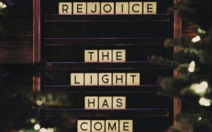 Rejoice: The Light Has Come" sign