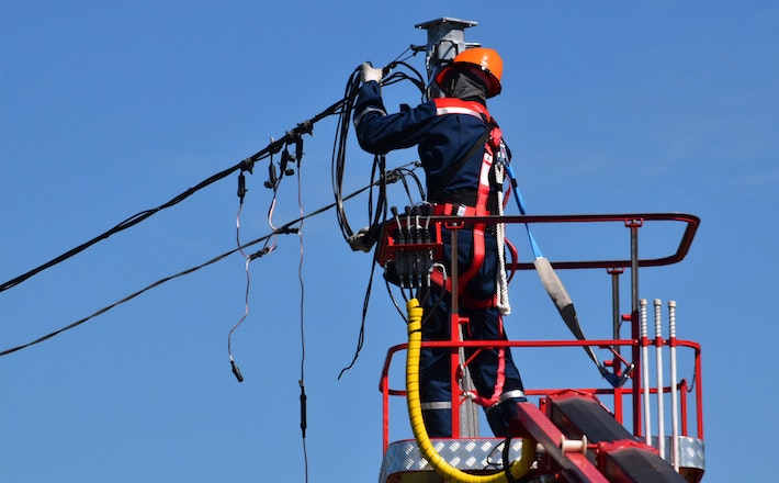 Electrician fixing power lines