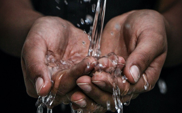 water pouring on hands