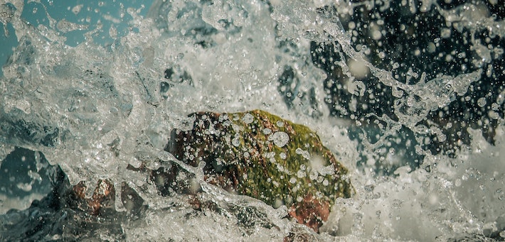 waves crashing on rock