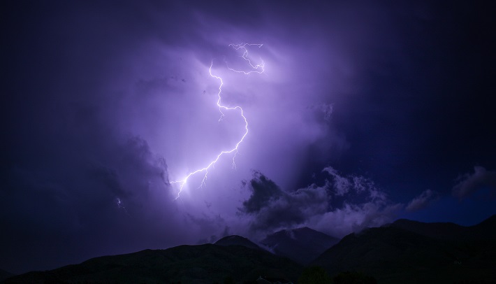 lightning strike on purple cloud background