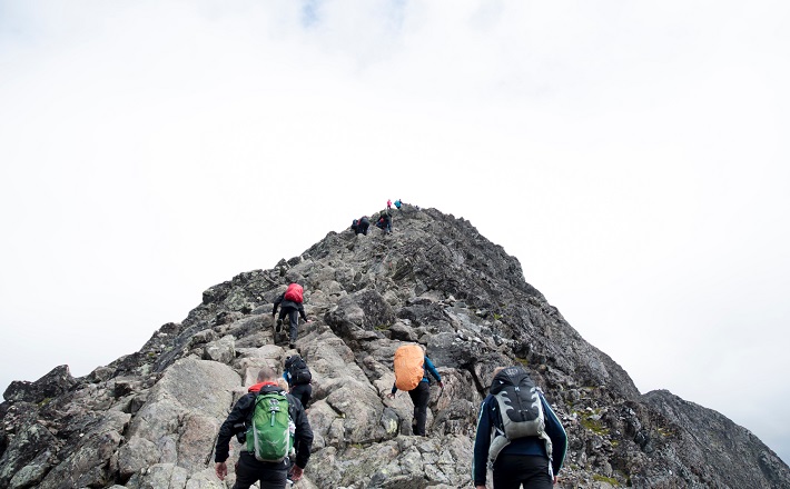 Climbers nearing peak of mountain