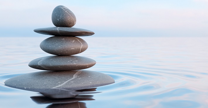 Rocks stacked on water