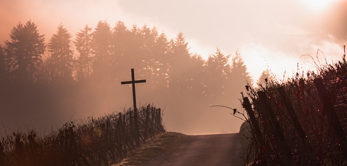 Cross alongside road on mountain pass