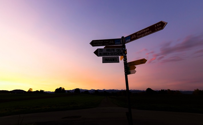 signpost silhouette at sunset