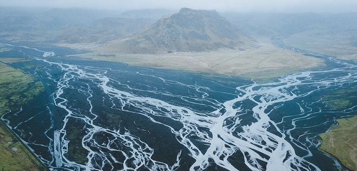 landscape in Iceland -- streams converging around a volcanic mountain