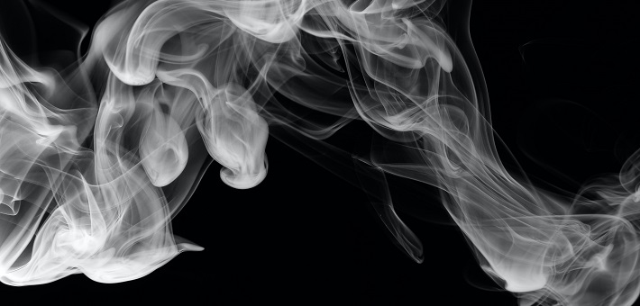 smoke drifting across black background