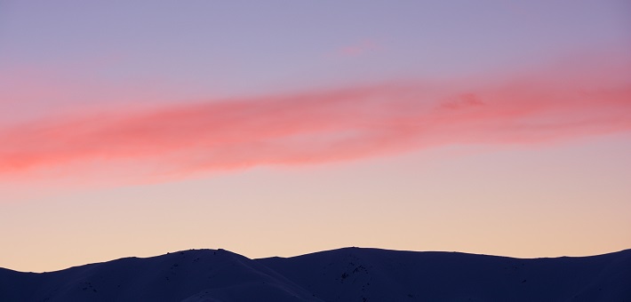 band of clouds over horizon