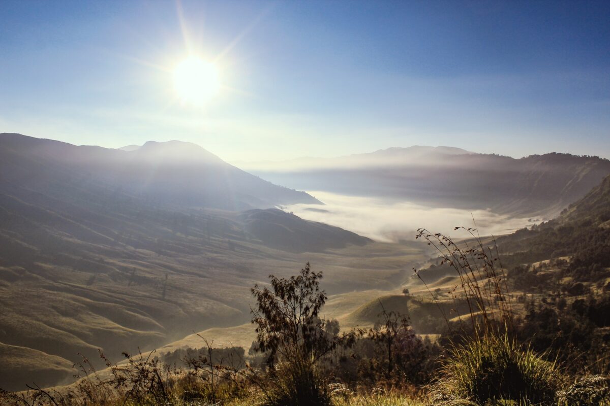 sun shining on a valley