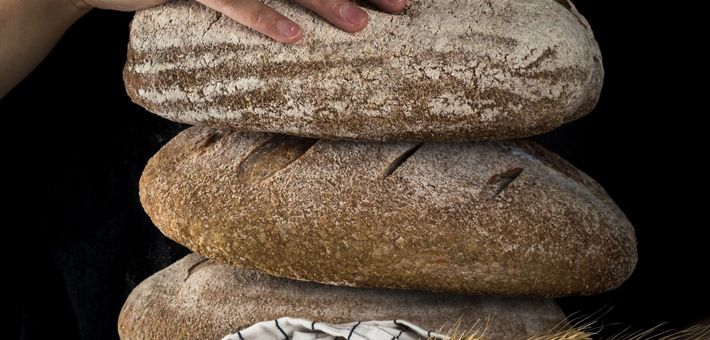 three loaves of bread stacked