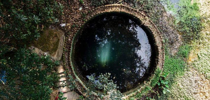 aerial view of a well filled to the brim with water