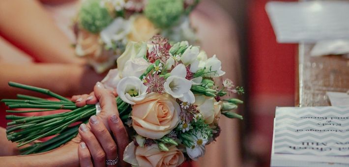 bridesmaids sitting with bouquets