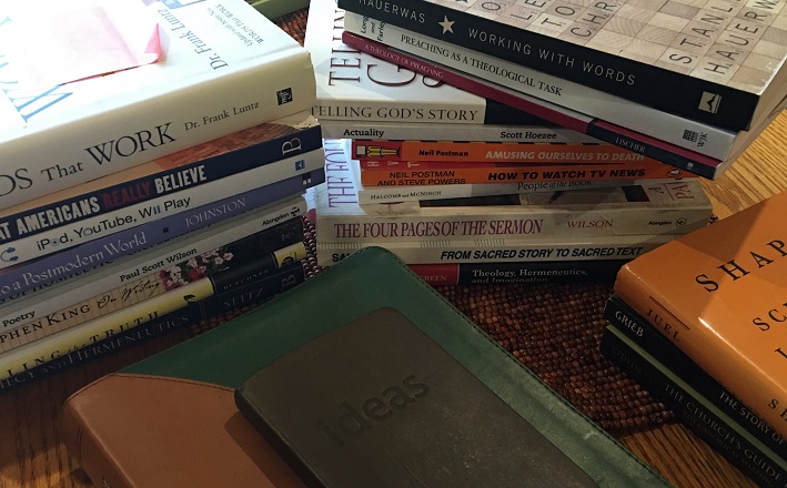 Pile of books on desk