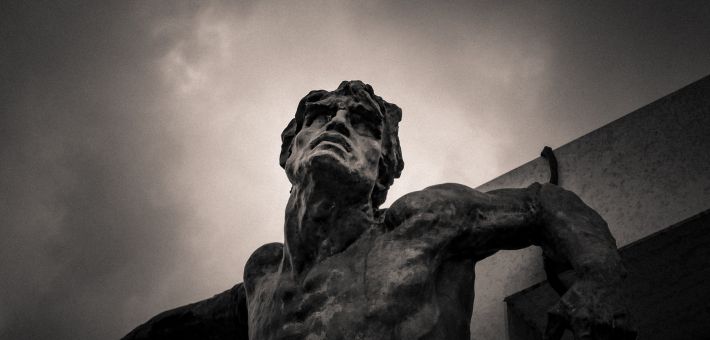 grey scale photo of Jesus on the Cross statue