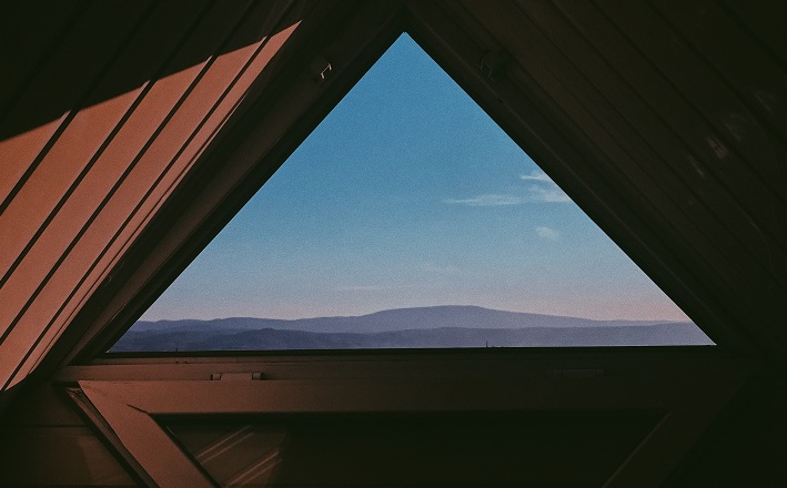 triangular aperture with view to distant landscape.