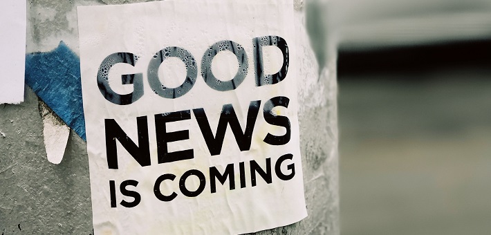 Flyer on lightpost saying Good News Is Coming