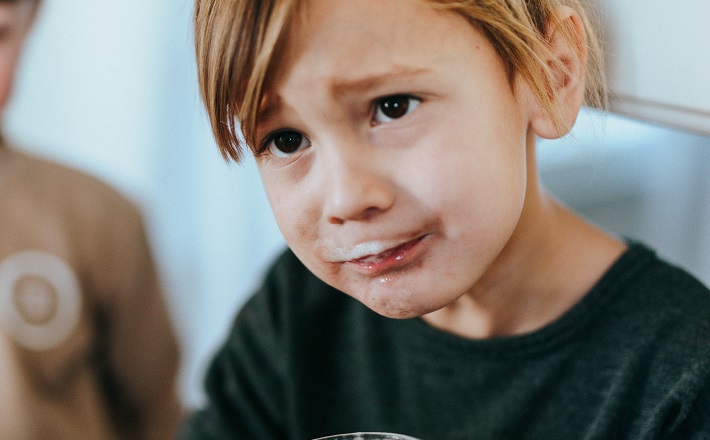 child with milk mustache concerned about stewardship