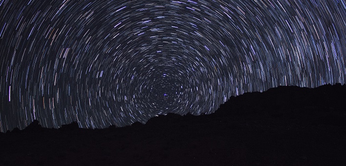 Starry night with dark landscape