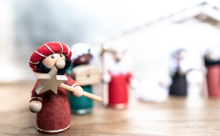 Magi figurine holding a star