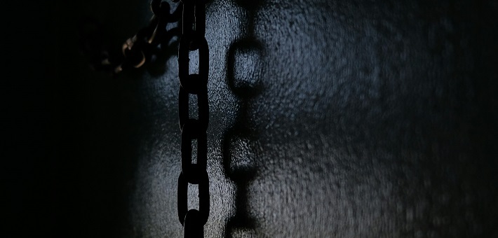 chains hanging in dark room