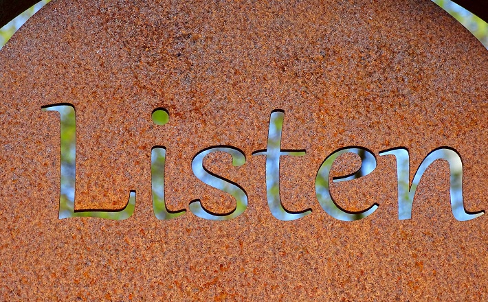 rusty sign that says Listen