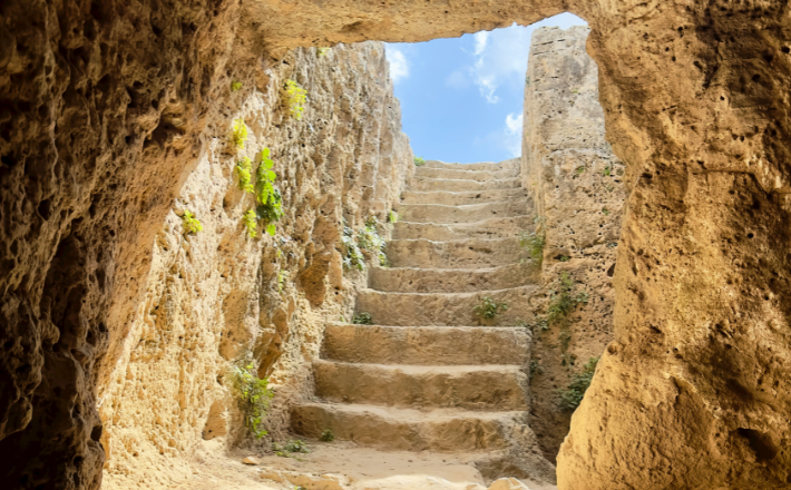 Photo of stairs going up from a cave in Cyrus