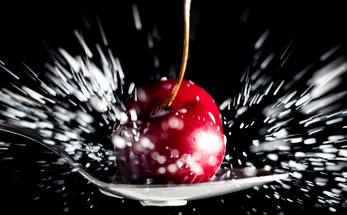 Spoon landing on cherry