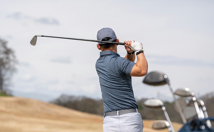 Golfer watching shot