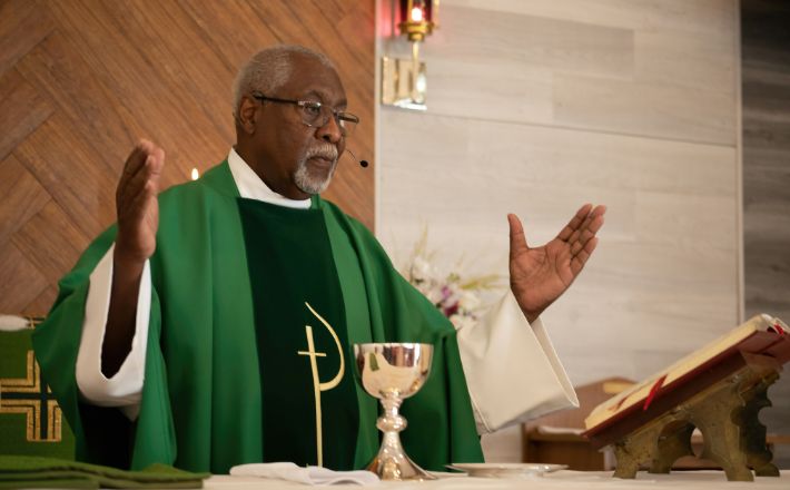 Sermon feedback to build community - pastor speaks from behind altar