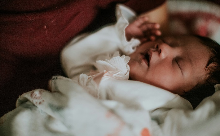 Baby lying in bed