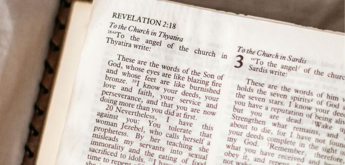 Detail of Bible open to Revelation 2