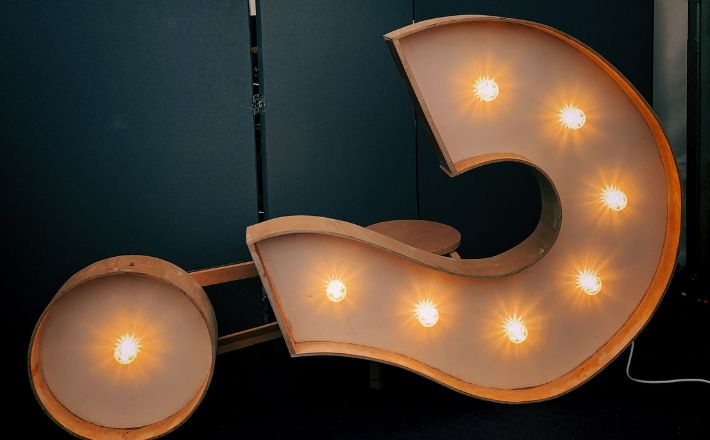 Preaching and AI? - Question mark with lights sitting on its side