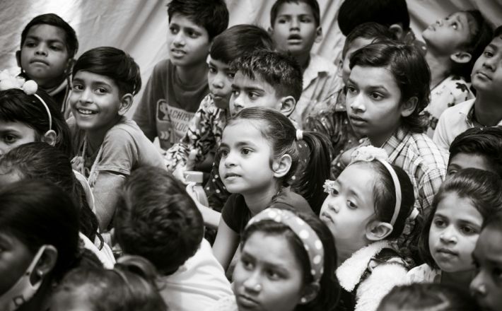 Children gathered with rapt attention