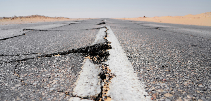 photo of an earthquake crack in a desert highway