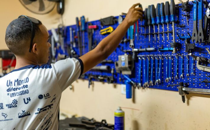 Mechanic reaching for tools