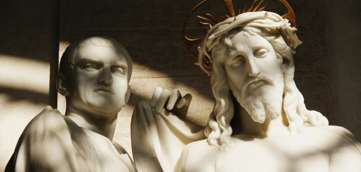 photo of statues of Jesus and Pilate