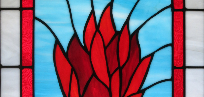 photo of holy spirit as fire stained glass window