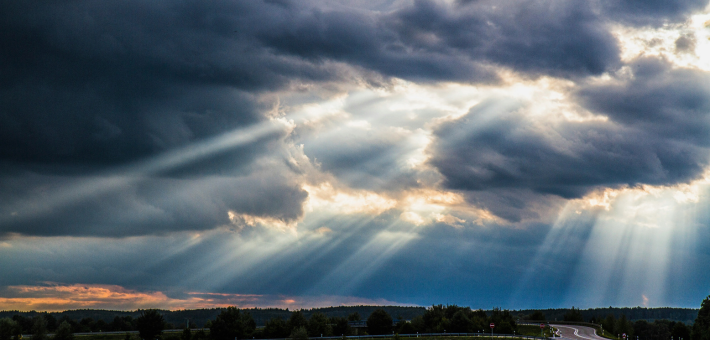 photo of clouds with light breaking through