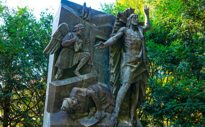 Bronze sculpture depicting biblical scene with angels and figures.